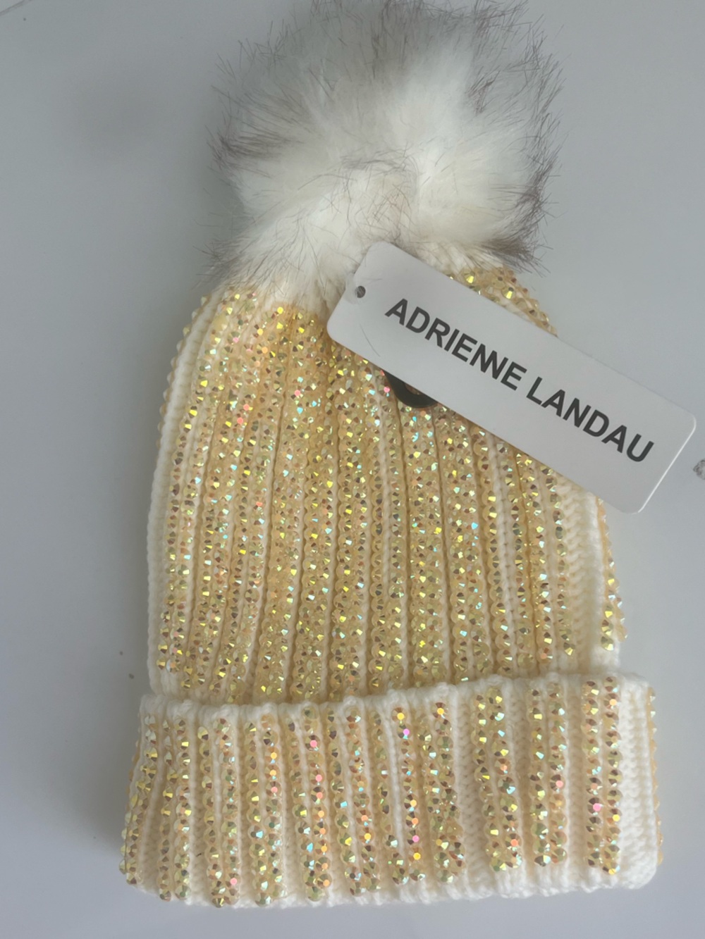 NWT Adrienne Landau Rhinestone knit beanie with pom Pom. ivory yellow gold